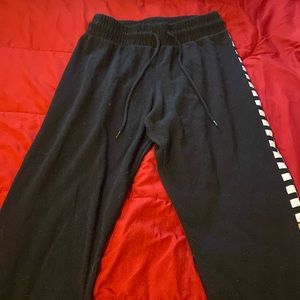 Small size sweat pants with “baby girl” lettering going up the leg